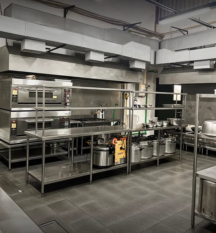 Wanderbakes central kitchen: deck ovens, stainless steel tables and shelving